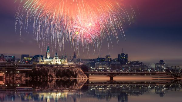 Fireworks over Parliament Hill with reflection, Ottawa