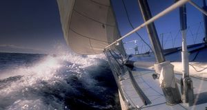 Foredeck of ocean racing yacht going through a wave-- Catherine Secula/Photolibrary &copy; (Bing United Kingdom)