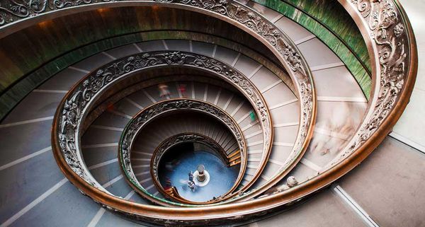 Visitors descending the spiral stairs of the Vatican Museums, Vatican City