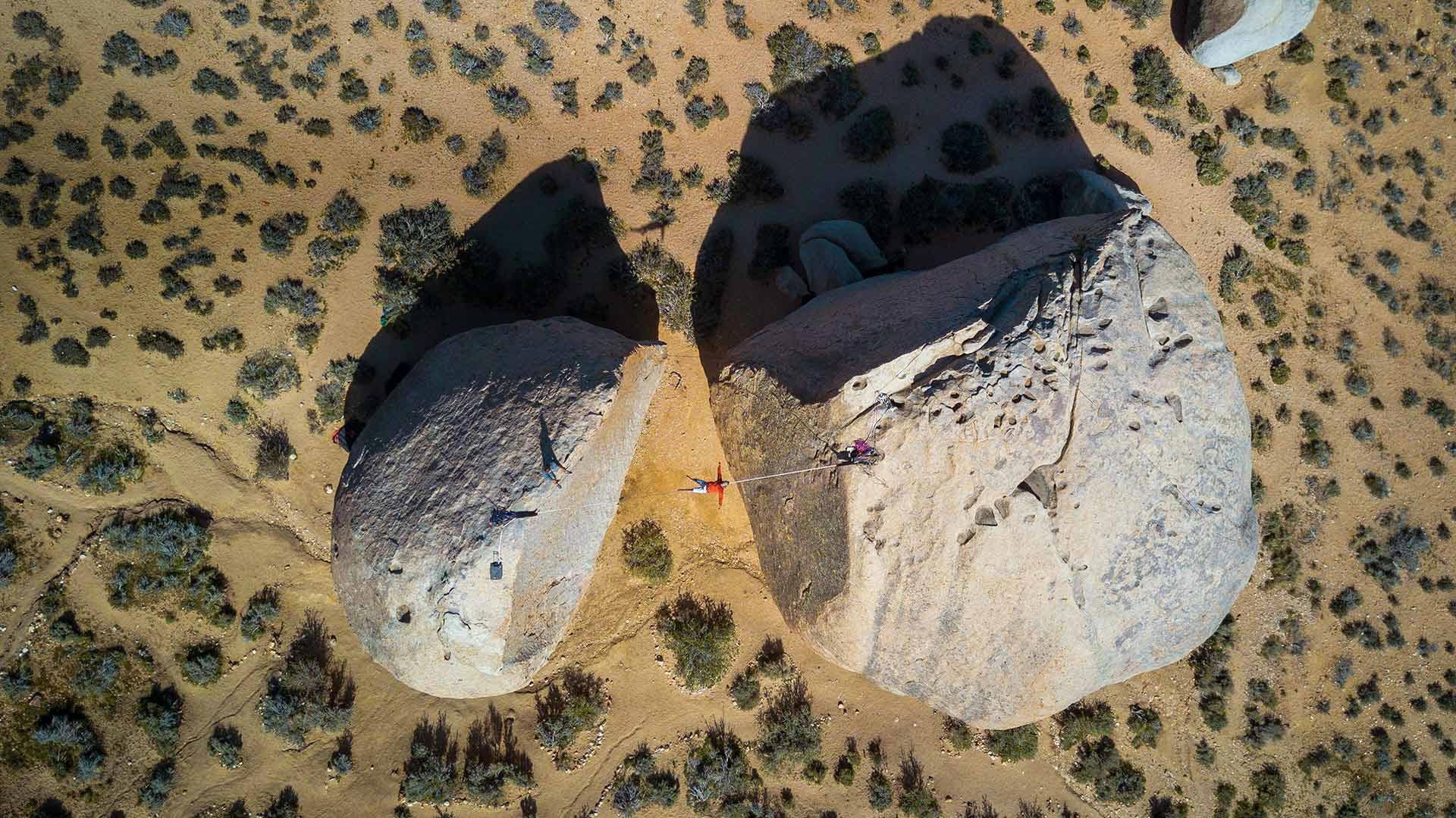 Slacklining between giant boulders in Bishop, California