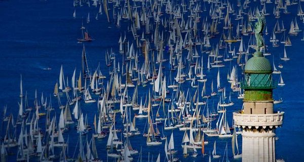 The boats of the Barcolana Regatta near the Faro della Vittoria (Victory lighthouse), Trieste, Italy