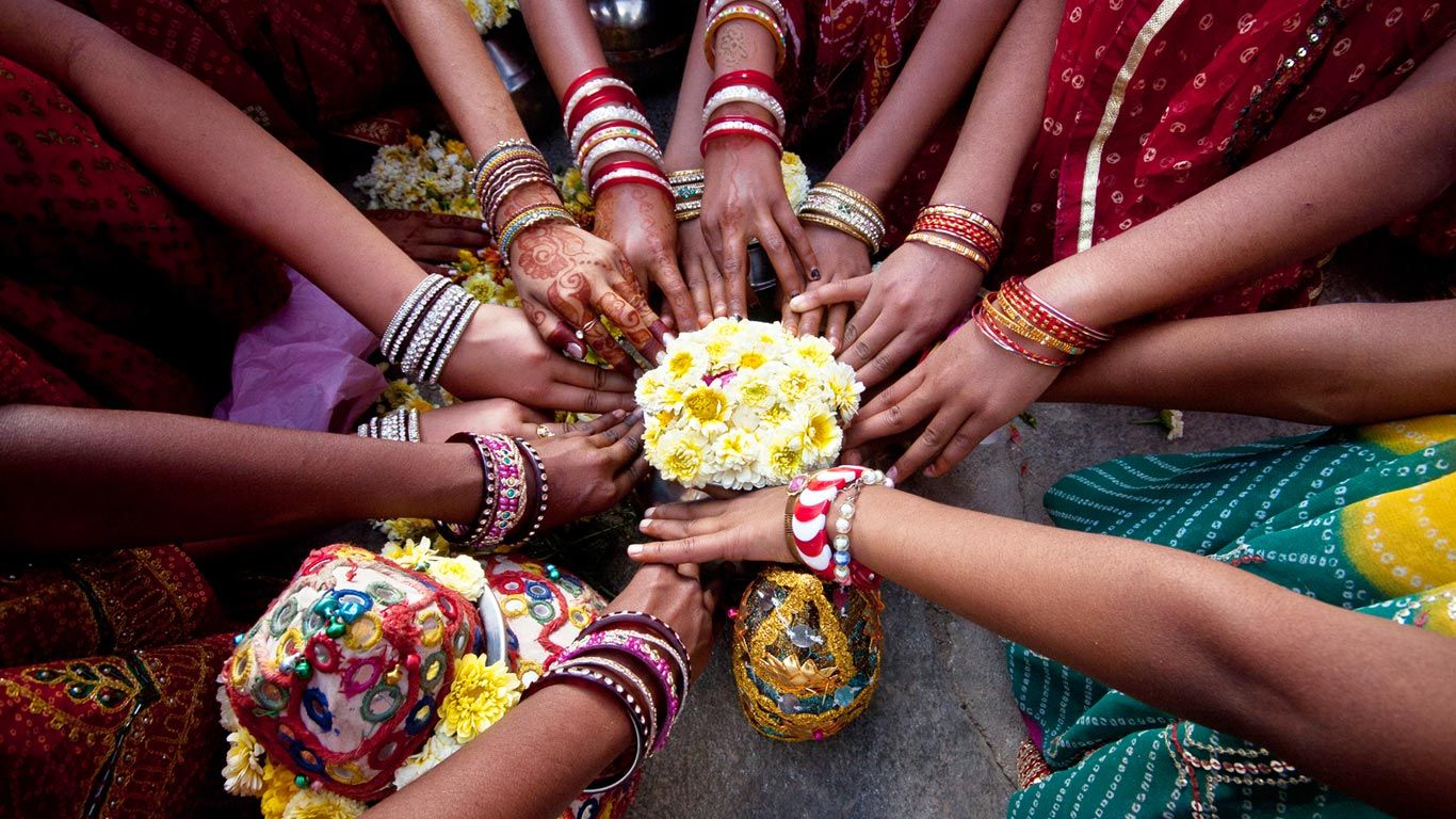 Indian girls praying together