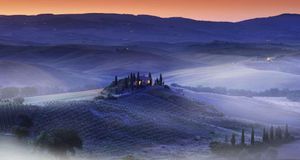 A hilltop villa in the Val d’Orcia, Siena district, Tuscany, Italy (© SIME/eStock Photo) &copy; (Bing New Zealand)