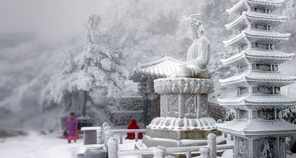 Snow blankets a temple on a mountain in South Korea's eastern Gangwon Province