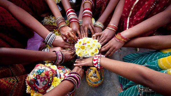 Indian girls praying together
