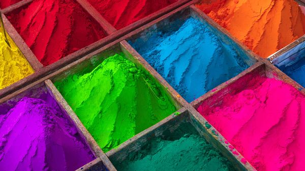 Brightly coloured powder for sale during Holi