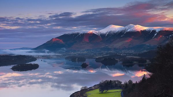 Sun rising over Skiddaw Mountain and Derwentwater in Cumbria, England