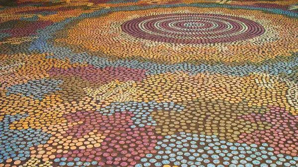 Mural of Papunya Tula artist Michael Nelson Tjakamarra’s ‘Possum and Wallaby Dreaming’ at Parliament House, Canberra
