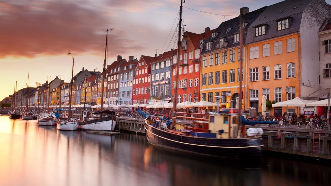 Colorful homes line Nyhavn Canal in Copenhagen, Denmark