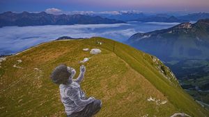 \'A New Breath\' by artist Saype in Moléson-sur-Gruyères, Switzerland (© Valentin Flauraud/Shutterstock)(Bing United States)