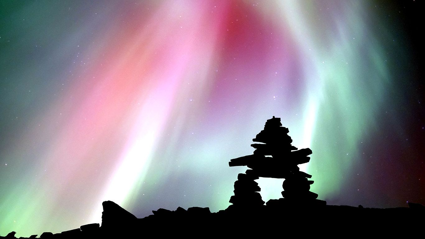 Aurora and Inukshuk,Yukon Territory, Canada