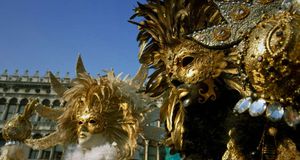 Two persons wearing Carnival masks in Venice, Italy – Matthias Tunger/age fotostock &copy; (Bing New Zealand)