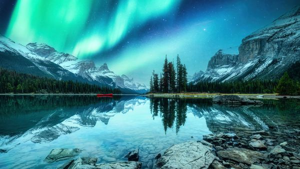 The aurora borealis over Spirit Island on Maligne Lake, Jasper National Park, Canada