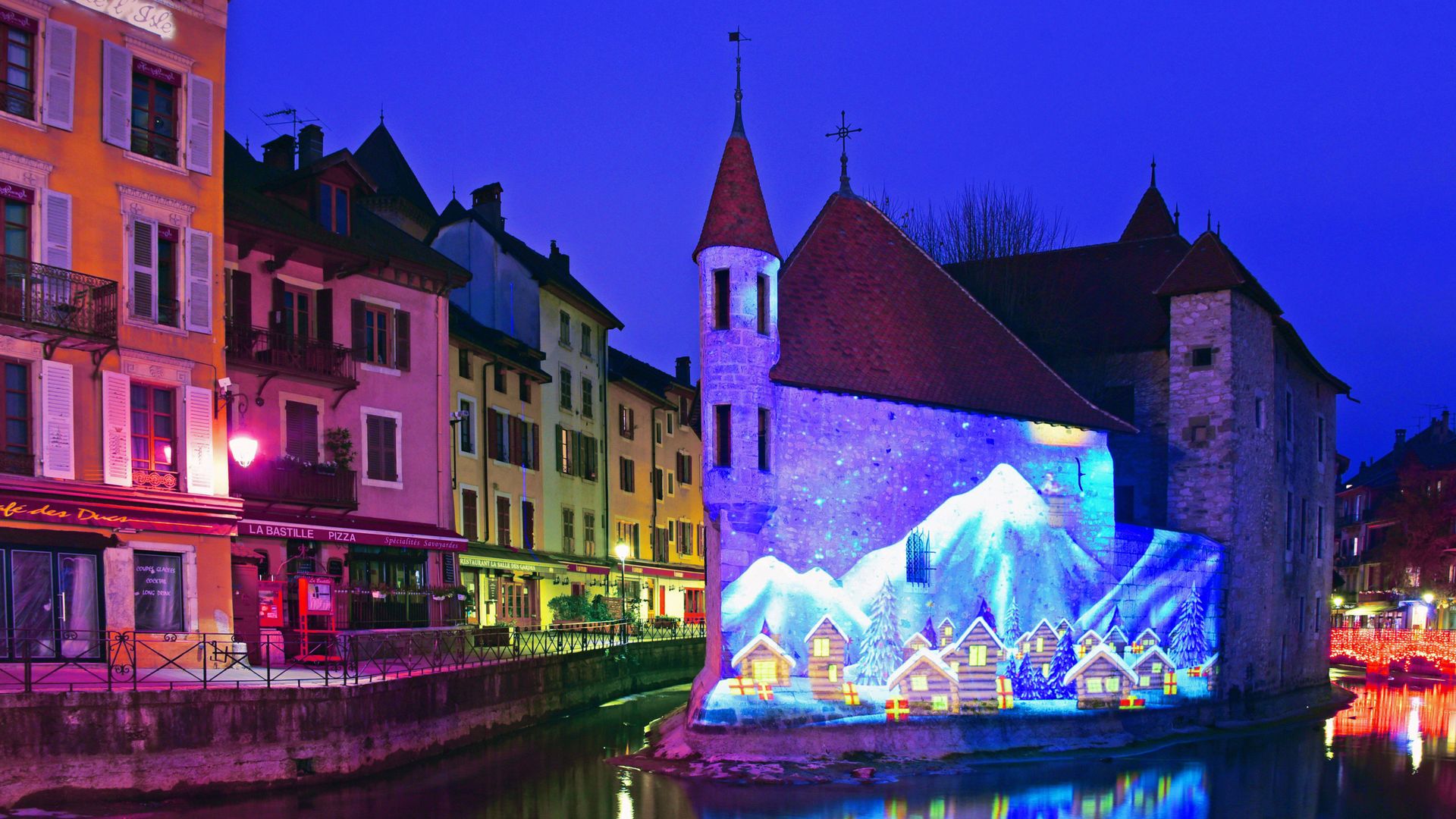 Winter scene illuminated on the Palais de l\'Isle in Annecy, Haute Savoie, France