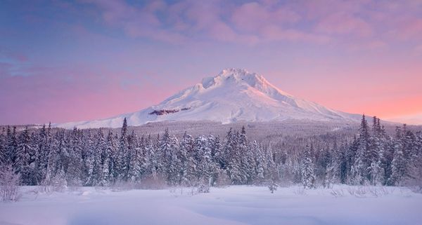 Beautiful sunrise over Oregon's Mount Hood after a fresh snowfall on the meadows below, USA