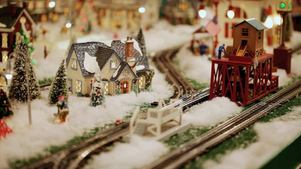 Model train set amidst a winter scene