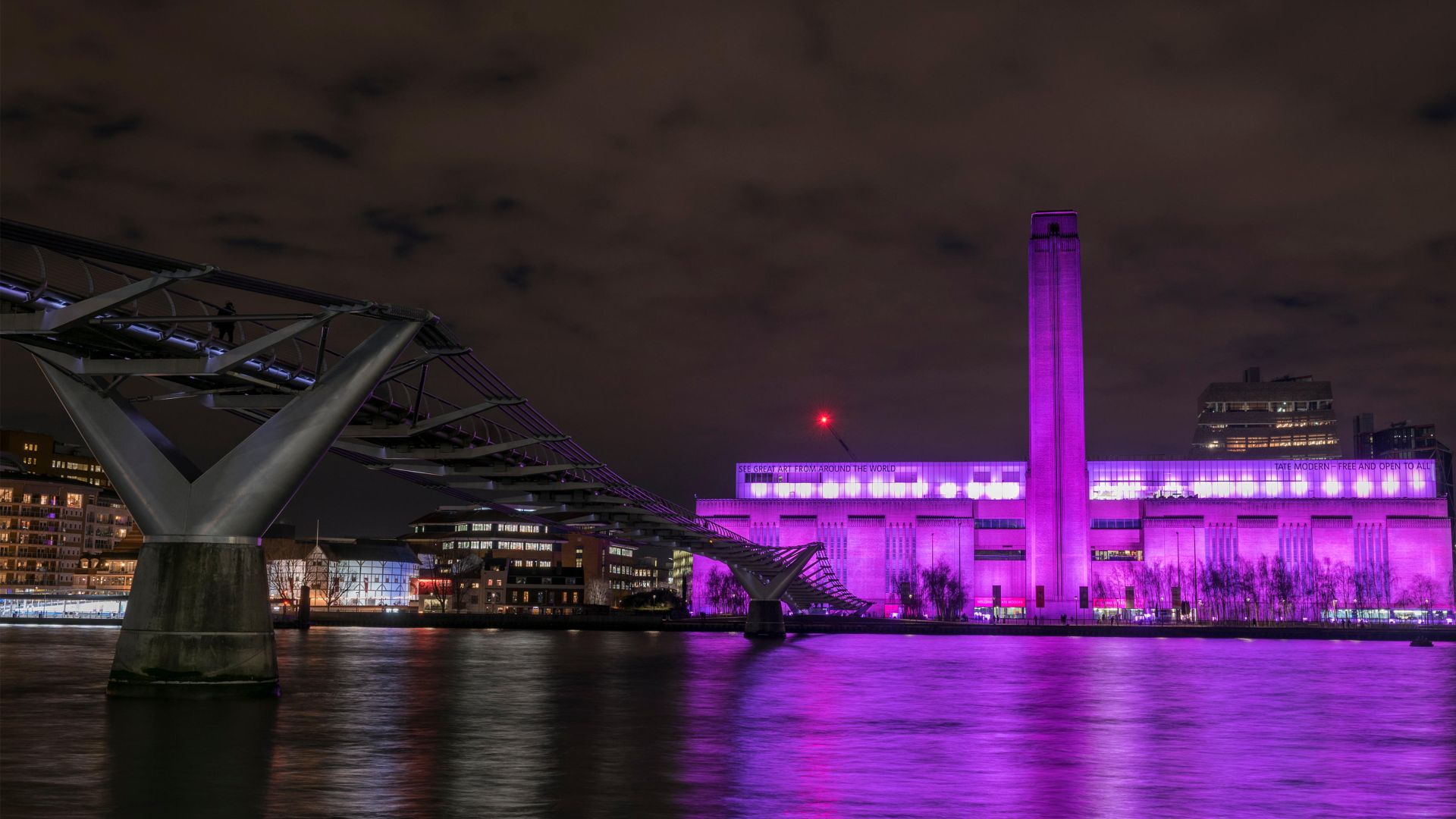 Tate Modern lit up on International Women's Day, London, England