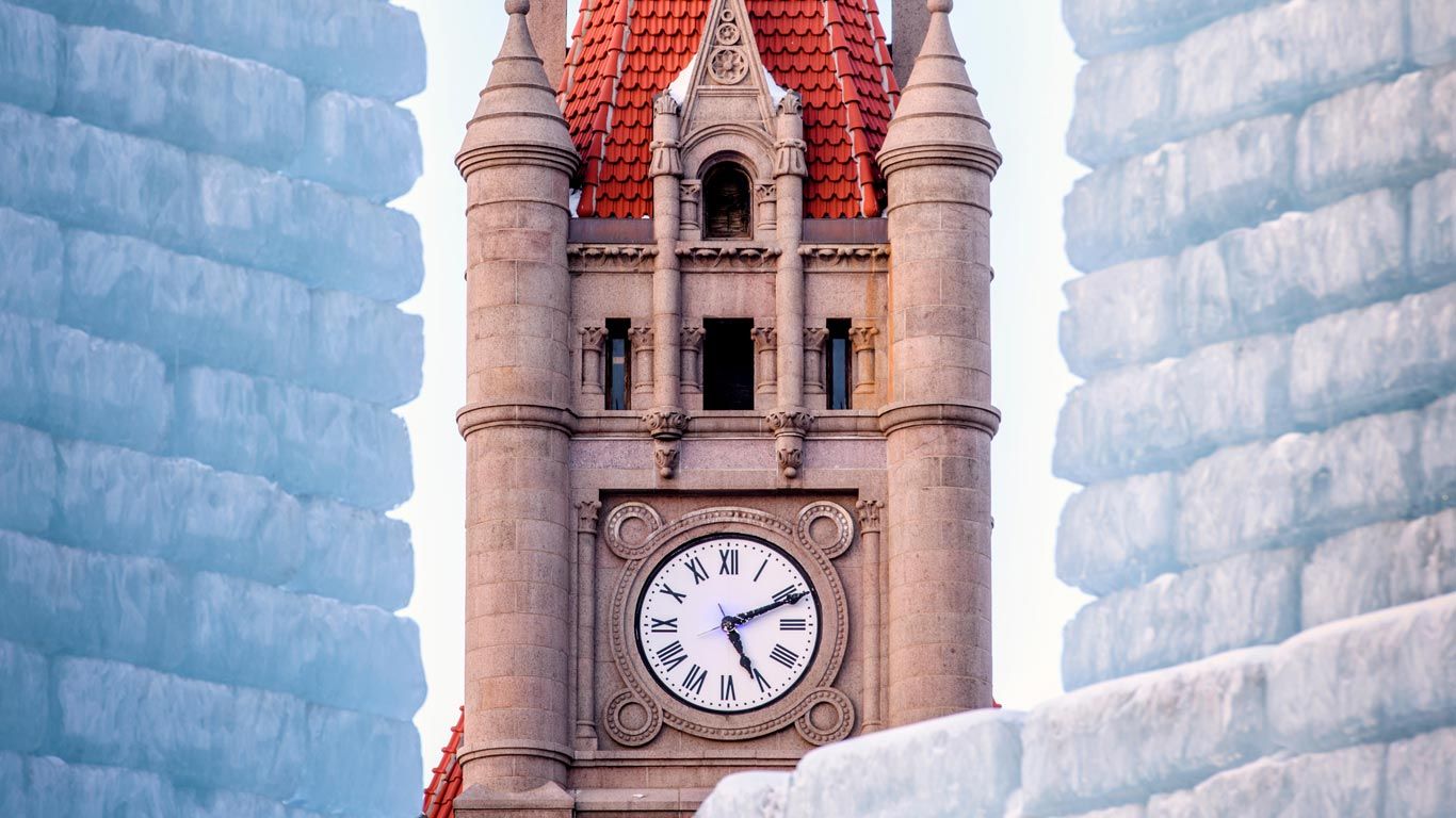 Landmark Center clock tower and Winter Carnival Ice Palace in Saint Paul, Minnesota, USA