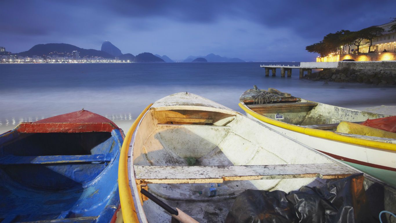 Fishing boats on Copacabana beach at dusk, Rio de Janeiro, Brazil