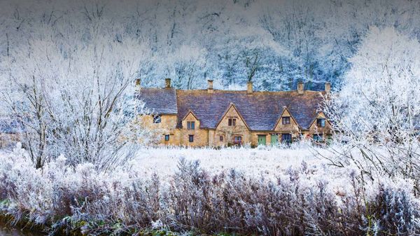 Houses beside the River Coln in Bibury, Gloucestershire