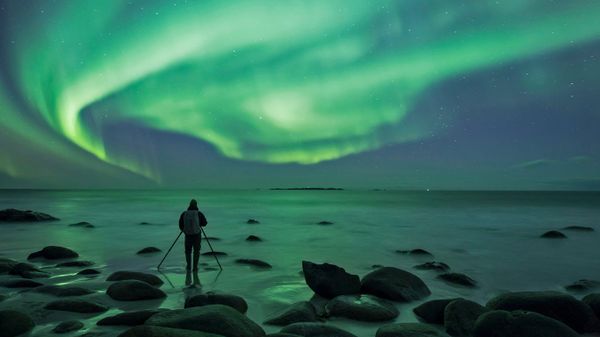 Photographing the aurora borealis at Uttakleiv Beach, Norway