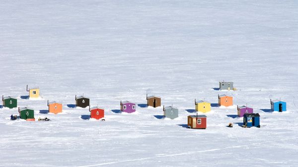 Ice fishing huts in L'Anse-St-Jean, Quebec, Canada