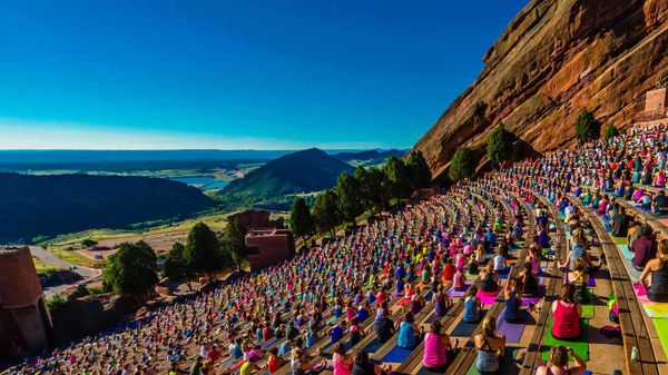 Yoga practitioners at Red Rocks Amphitheatre in Colorado