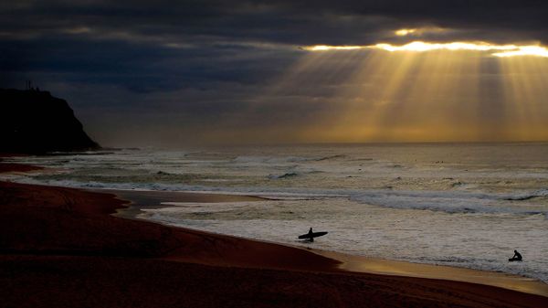 Surfers at Bar Beach near Newcastle, New South Wales