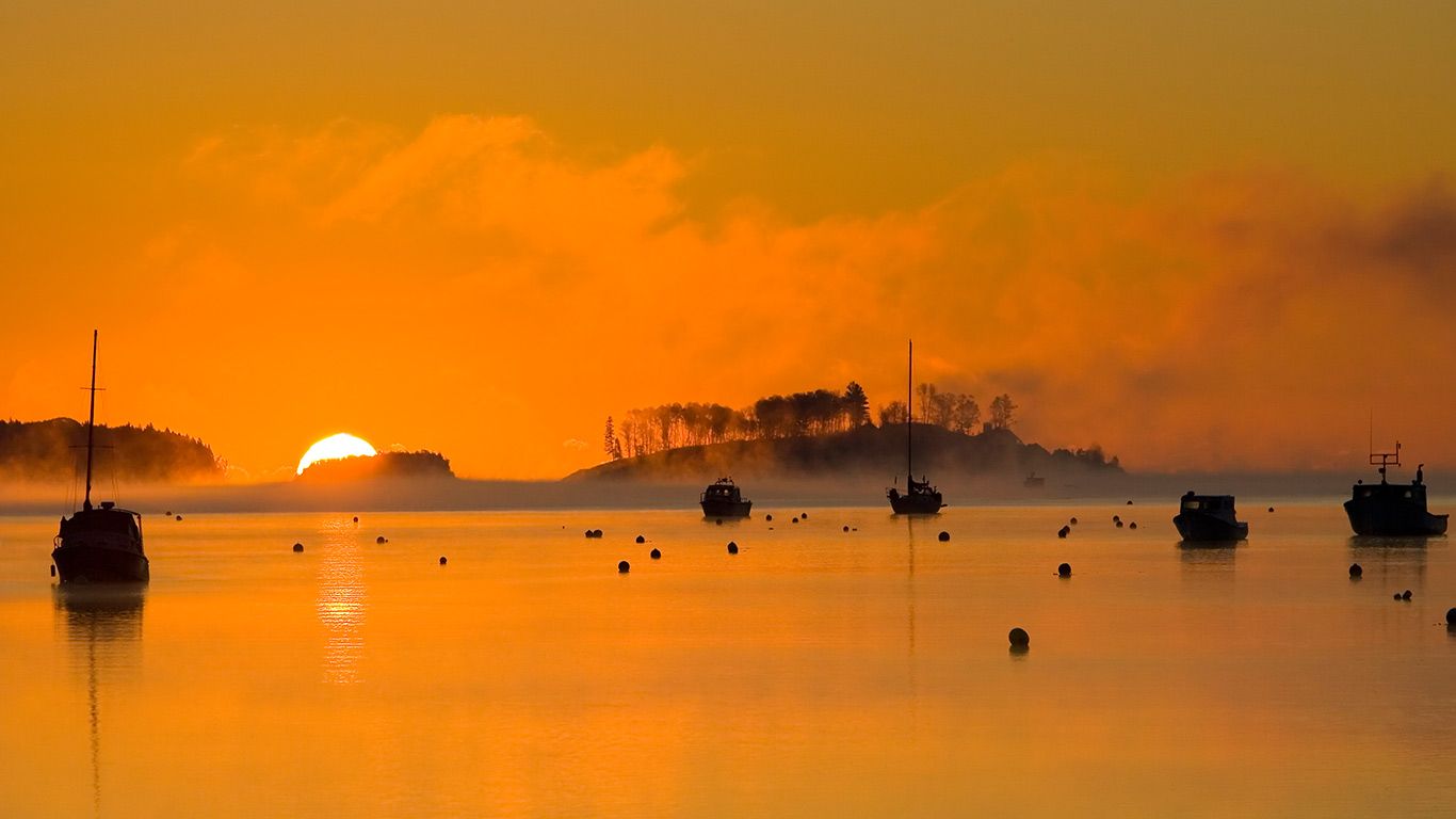 Silhouettes of fishing boats in Mahone Bay, Nova Scotia, Canada