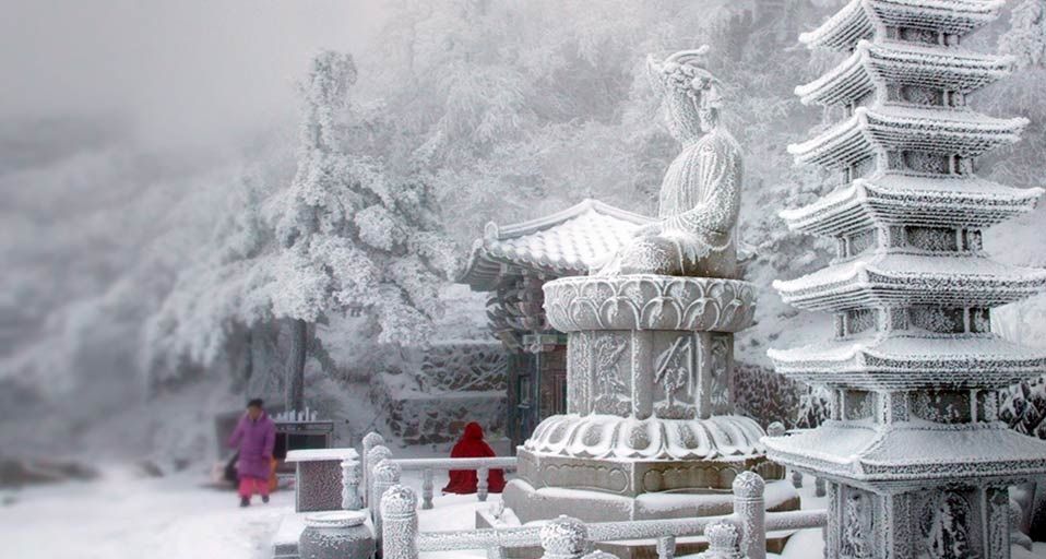 Snow blankets a temple on a mountain in South Korea's eastern Gangwon Province