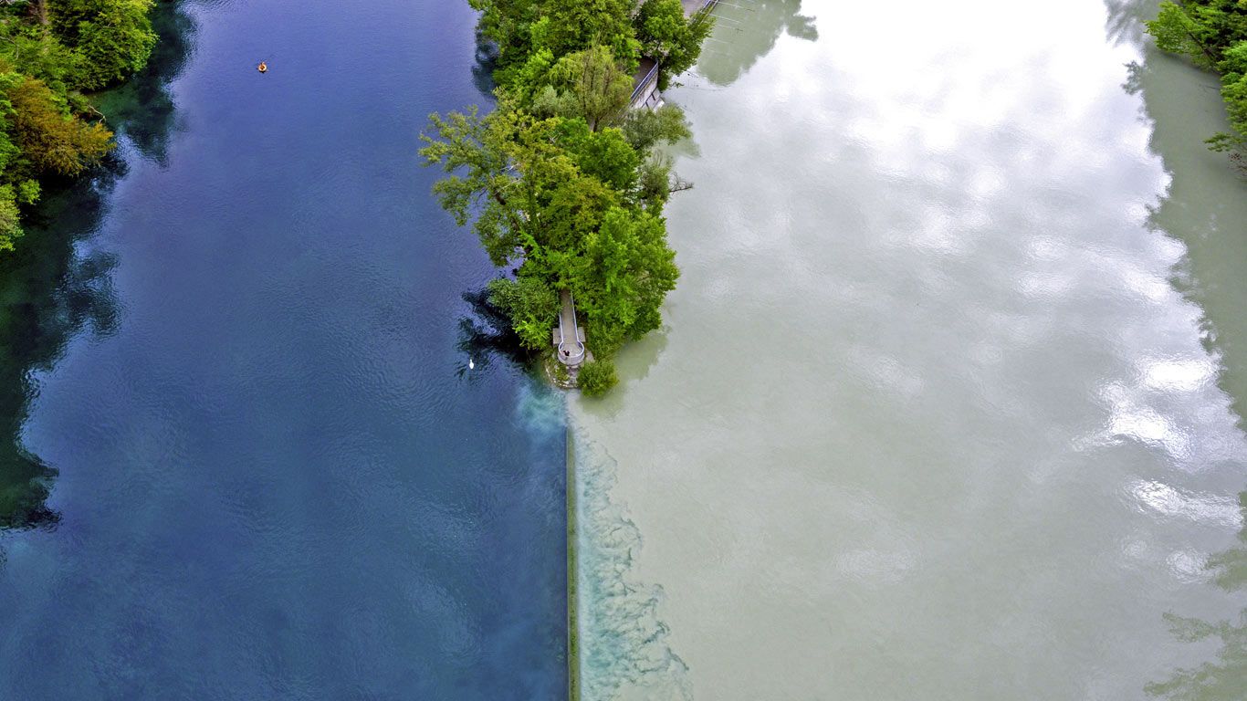 The river Arve (right) flowing into the Rhône in Geneva, Switzerland