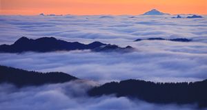 Fog over Spray Park in Mount Rainier National Park with Glacier Peak in the background, Washington (© Stephen Matera) &copy; (Bing Australia)