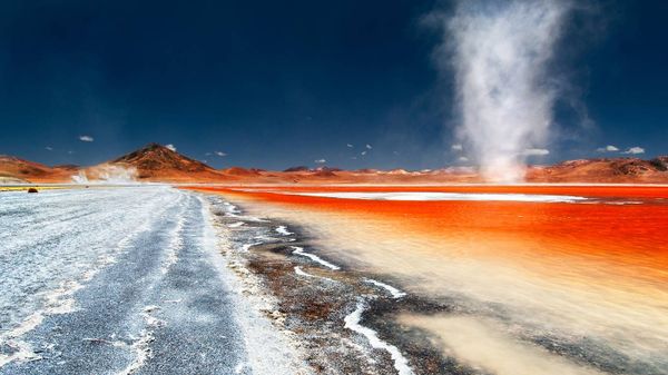 A dust devil swirls across Laguna Colorada in Bolivia