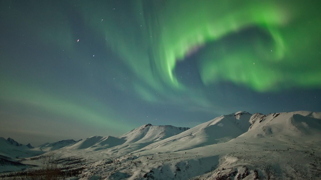 Aurora borealis dances over the Klondike Valley in Tombstone Territorial Park, Yukon