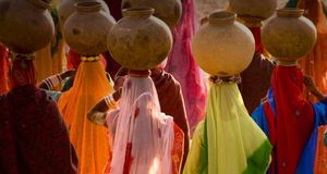 Women carrying pots, Rajasthan, India -- Eric Meola/Getty Images &copy; (Bing New Zealand)