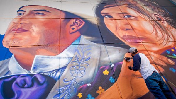 Artist Jesus \'CIMI\' Alvarado painting his mural \'Fronterizos\' on a wall of the El Paso Museum of Art, El Paso, Texas