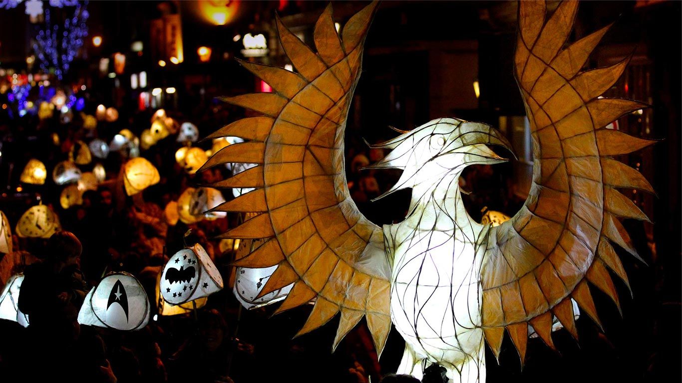 People carry lanterns at the Burning The Clocks Festival on December 21, Brighton, England