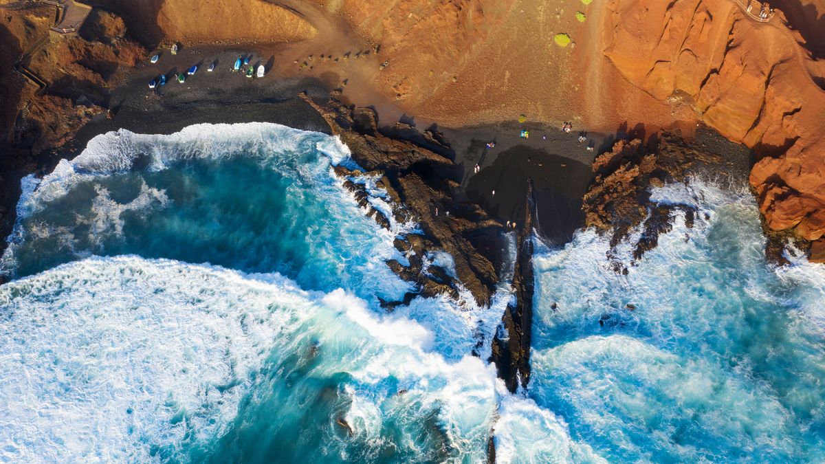Aerial view of black lava beach, El Golfo, Lanzarote, Canary Islands, Spain