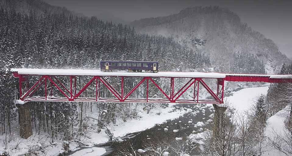 Akita Railway traveling over an iron bridge, Tohoku, Japan