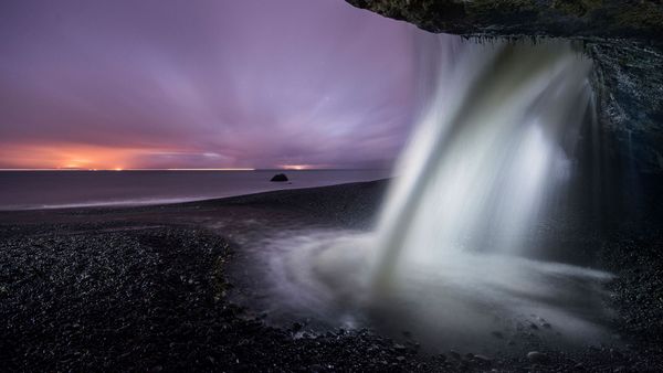 View of a waterfall at Mystic Beach in Juan de Fuca Provincial Park, B.C. during dusk