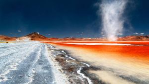 A dust devil swirls across Laguna Colorada in Bolivia (© Dordo Brnobic/Corbis)(Bing New Zealand)