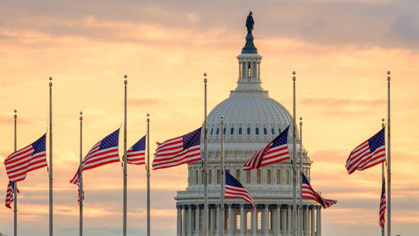 The US Capitol dome with flags flying at half-staff in honor of former President Jimmy Carter, Washington, DC