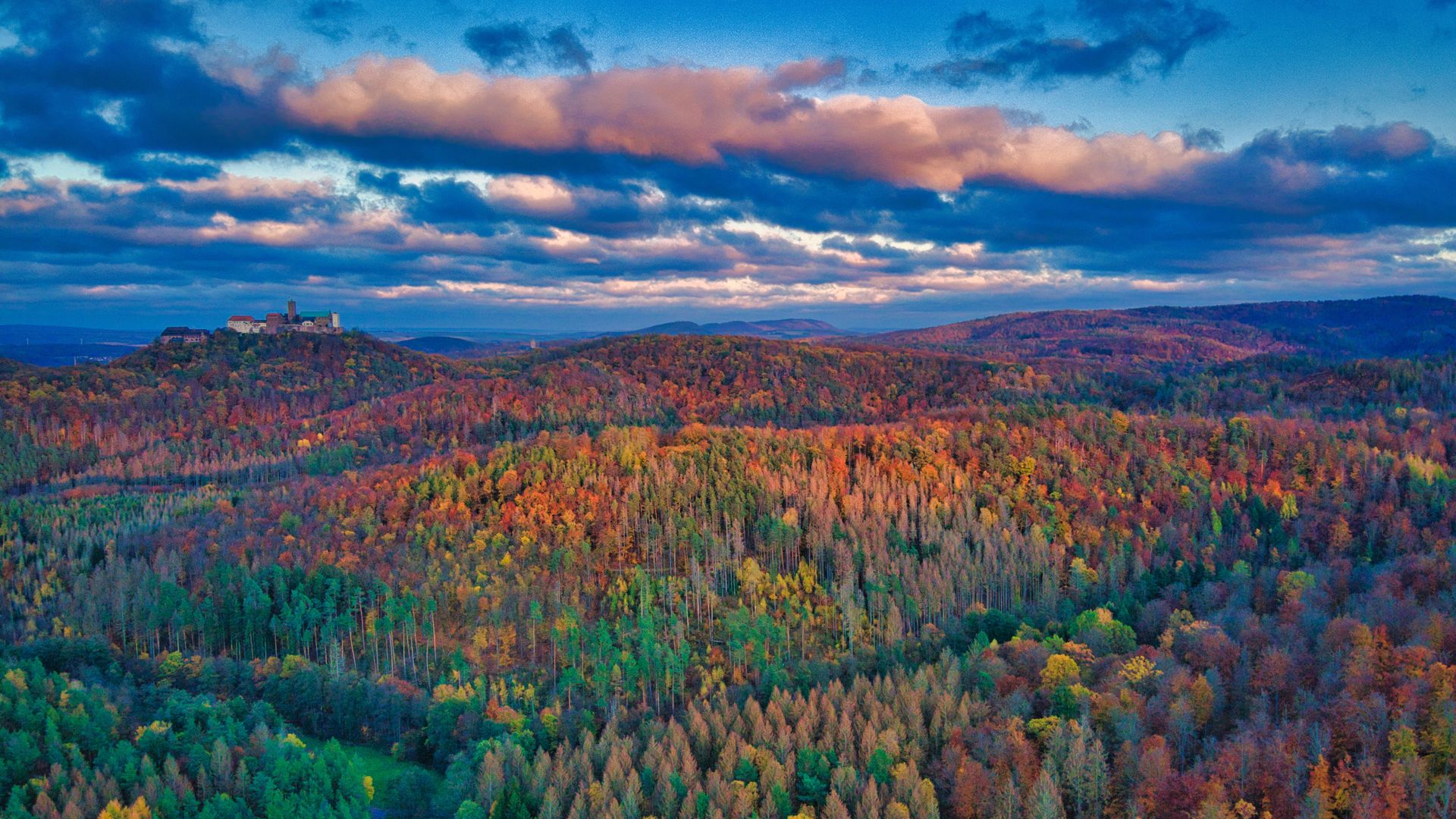 Thuringian Forest in autumn with Wartburg Castle, Germany