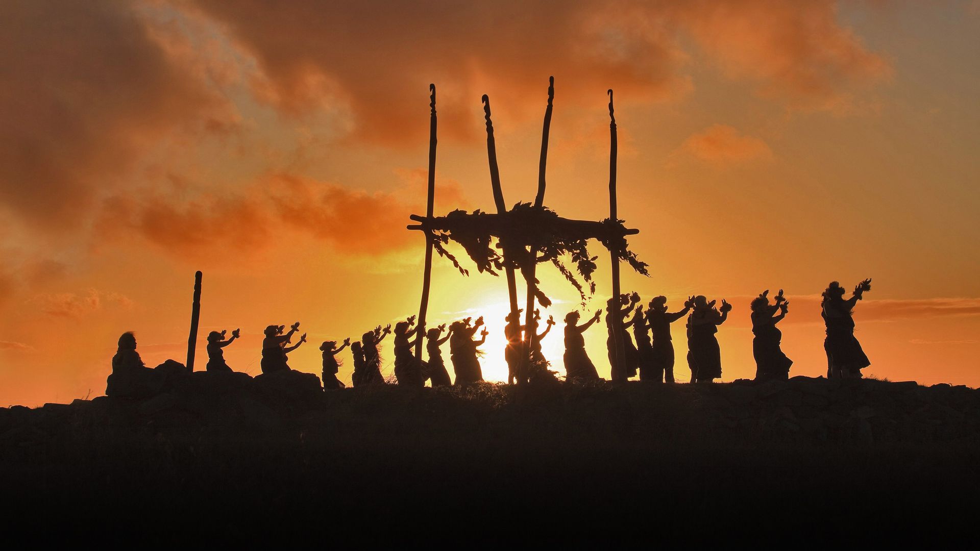 Dancers on the site of a lele (altar) on Mount Maunaloa, Molokai, Hawaii