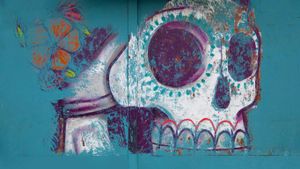 Mural of sugar skull (calavera) in Oaxaca, Mexico (© Judy Bellah/Alamy)(Bing Australia)