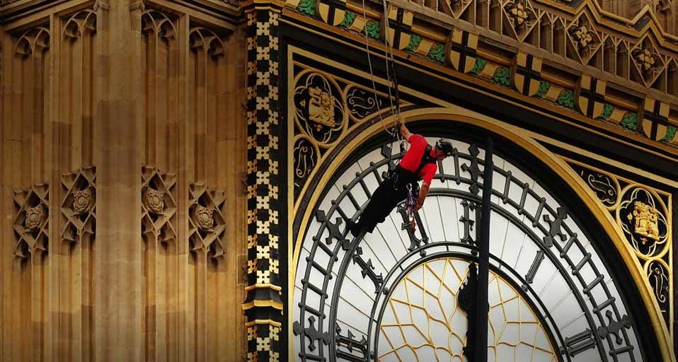 Workers carry out repairs to the clock faces on St Stephen's Tower – commonly called  “Big Ben” – in London, England