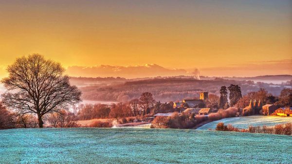 St Mary\'s church and oast houses in Salehurst, East Sussex