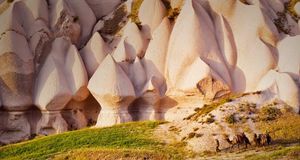 Eroded rock formations and camels in Uchisar, Cappadocia, Turkey -- Marc Dozier/Corbis &copy; (Bing Australia)