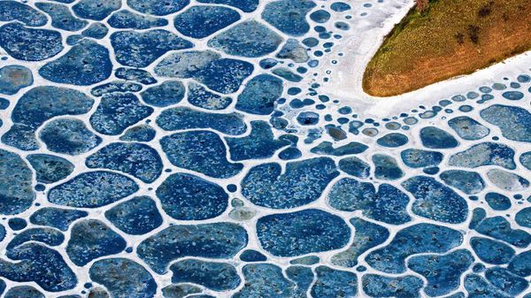 Aerial over unknown lake in the Cariboo region of British Columbia, Canada