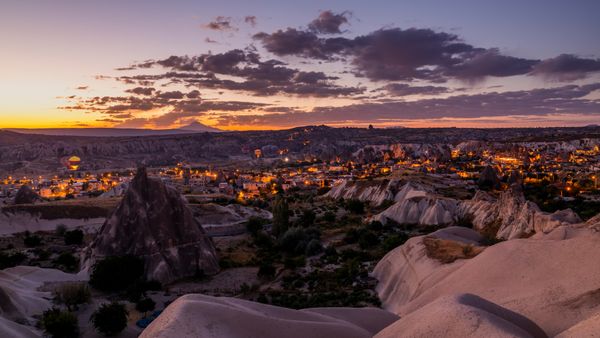 Hot air balloons over Göreme Historical National Park in Cappadocia, Türkiye